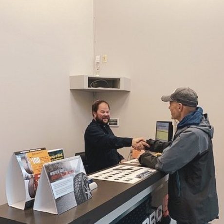 Owner of 1st Street Garage greeting a customer